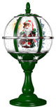 23" Tabletop Musical Snow Globe With Santa Scene, Snow, and Carols, Green
