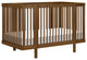 Pogo 8-in-1 Convertible Crib With All-Stages Conversion Kits, Natural Walnut