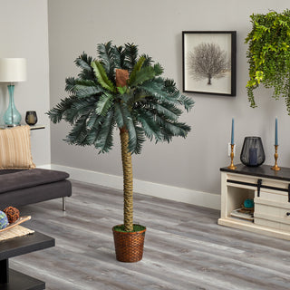 Lifestyle shot in a real room showing the entire tree with decor; not on white background; no text overlays.