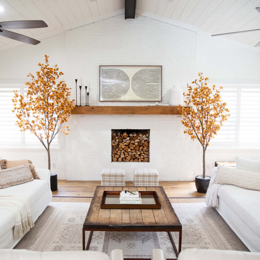 Lifestyle image showing the tree in a living room setting; full product visible.
