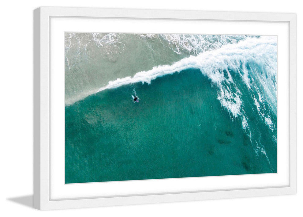 "Riding The Wave" Framed Print by Karolis Janulis