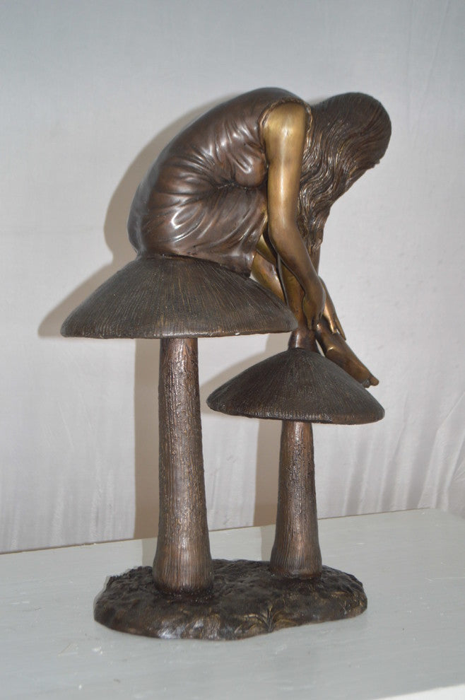 Girl sitting on Mushrooms Bronze Statue -  Size: 13"L x 11"W x 18"H.
