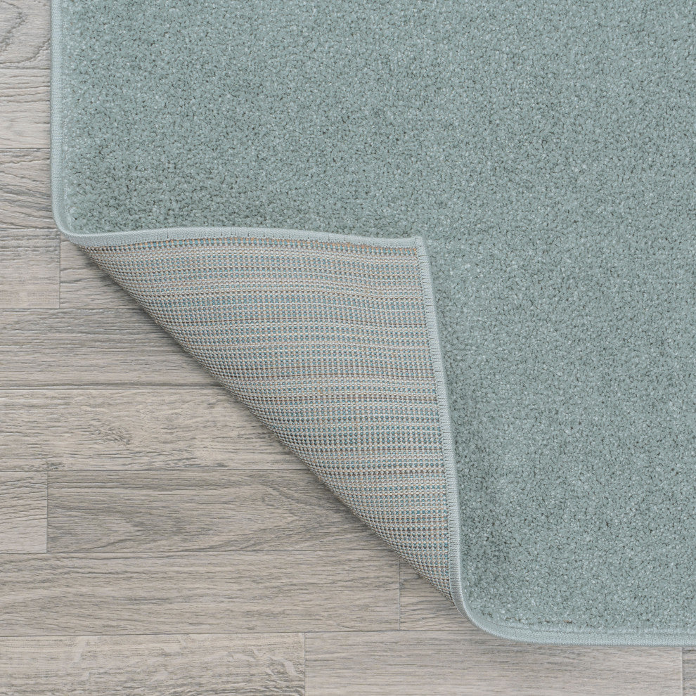 Haze Solid Low-Pile Light Blue 6 ft. x 9 ft. Oval Area Rug