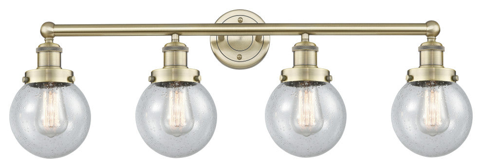 Small Beacon 4-Light 34" Bath Vanity Light, Antique Brass Finish, Seedy Shade