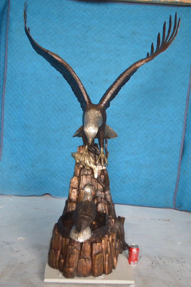 Eagle with nest Bronze Statue -  Size: 36"L x 40"W x 63"H.