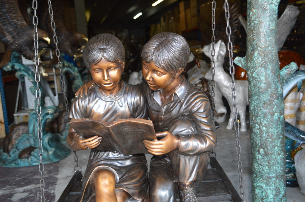 Kids on Swing Set Reading a Book Life Size Bronze Statue -  50"L x 40"W x 70"H