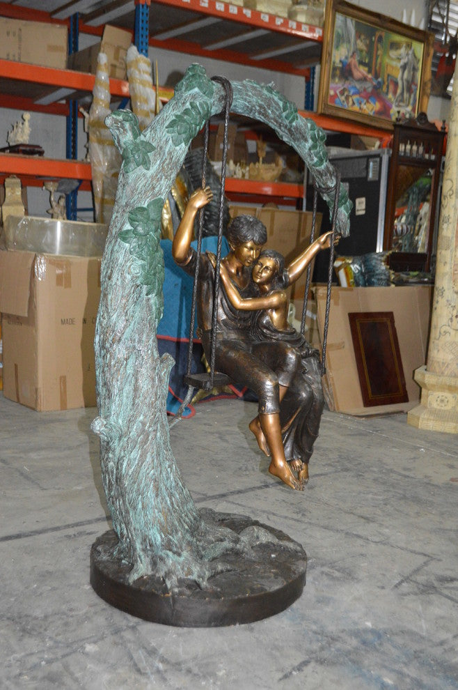 Lovers on a Swing Bronze Statue -  Size: 48"L x 32"W x 64"H.