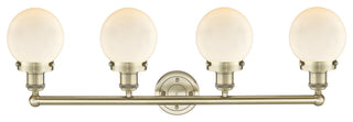 Small Beacon 4-Light 34" Vanity Light, Antique Brass Finish, Matte White Shade