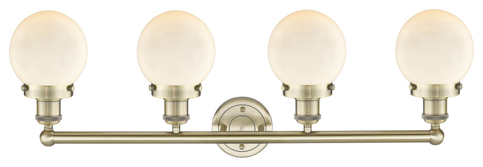 Small Beacon 4-Light 34" Vanity Light, Antique Brass Finish, Matte White Shade