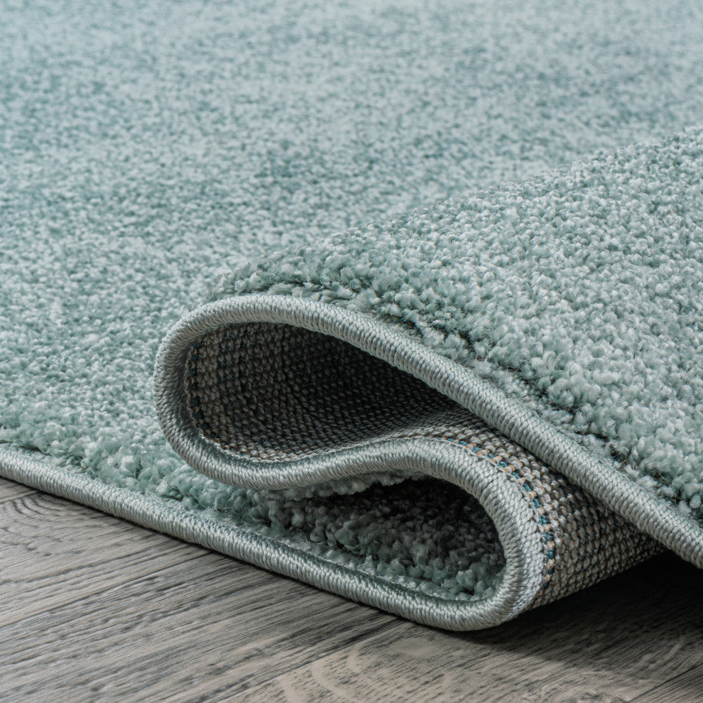Haze Solid Low-Pile Light Blue 6 ft. x 9 ft. Oval Area Rug