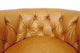 Retro Tufted Caramel Leather Swivel Chair
