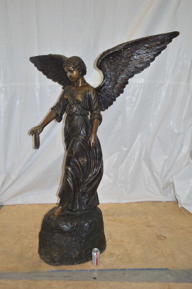 Angel Standing on a Rock Bronze Statue -  Size: 60"L x 36"W x 71"H.