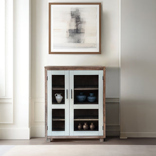 Lifestyle image showing the cabinet in a real room setting with decor; full product visibility.