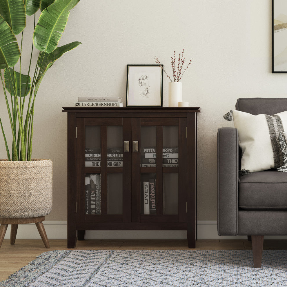 Product shown in a real room setting with plant and sofa.