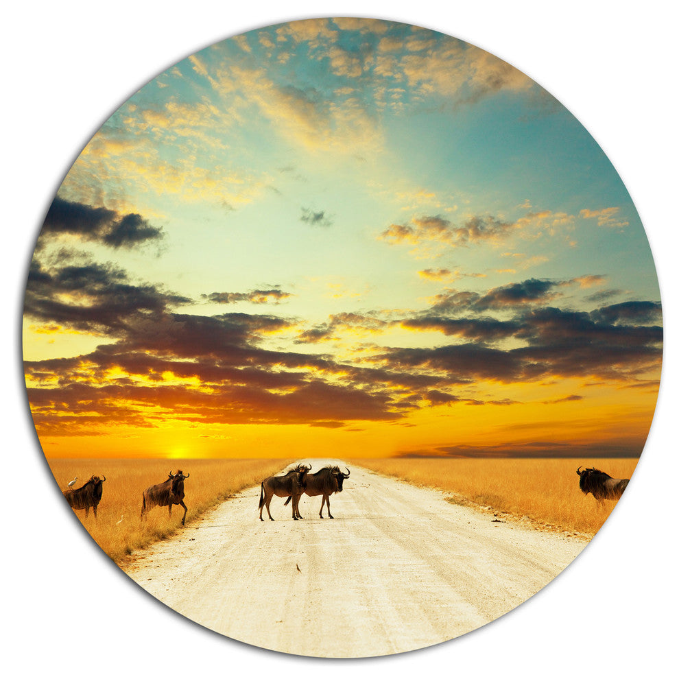 Wildebeests Crossing Path In Evening, African Disc Metal Wall Art, 23"