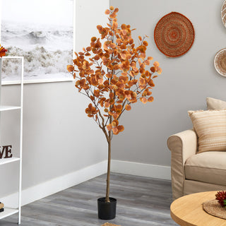 Lifestyle image showing the tree in a real room environment, with full product visible.