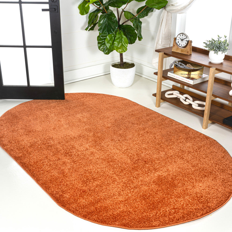 Haze Solid Low-Pile Orange 5 ft. x 8 ft. Oval Area Rug