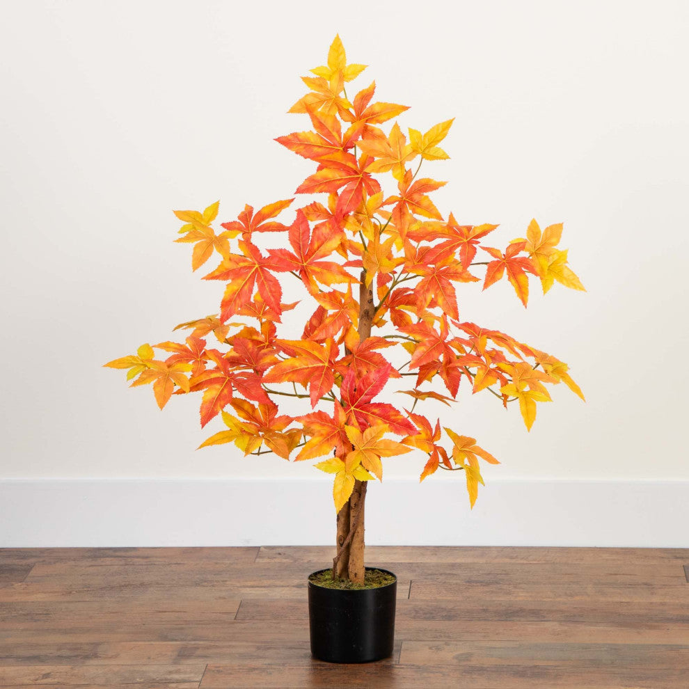 Shown in a real room setting; full tree visible; background not a pure white backdrop.