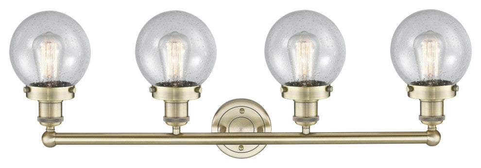 Small Beacon 4-Light 34" Bath Vanity Light, Antique Brass Finish, Seedy Shade