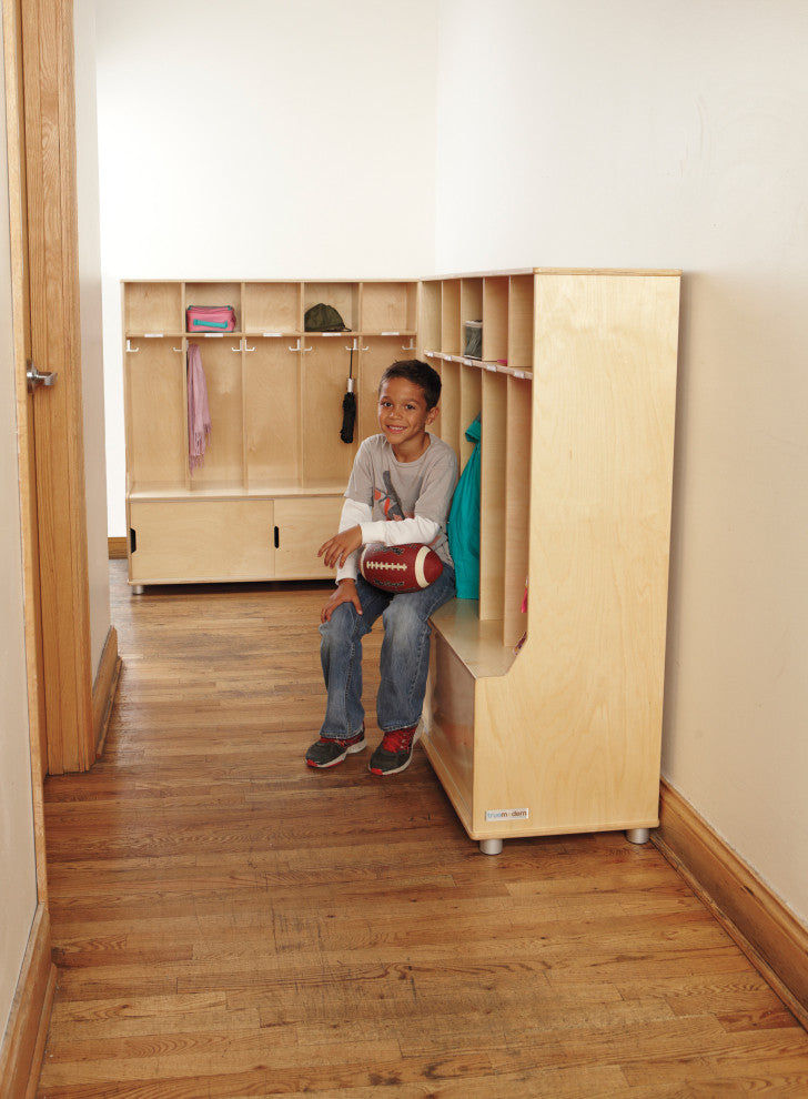 Lifestyle shot of a child with the unit in a hallway/kid-friendly space; product visible.