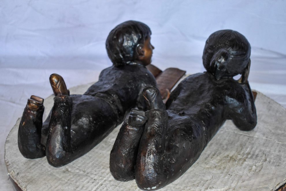 Young Kids Laying and Reading Cheerfully Bronze Statue Set Size: 20" x 13" x 8