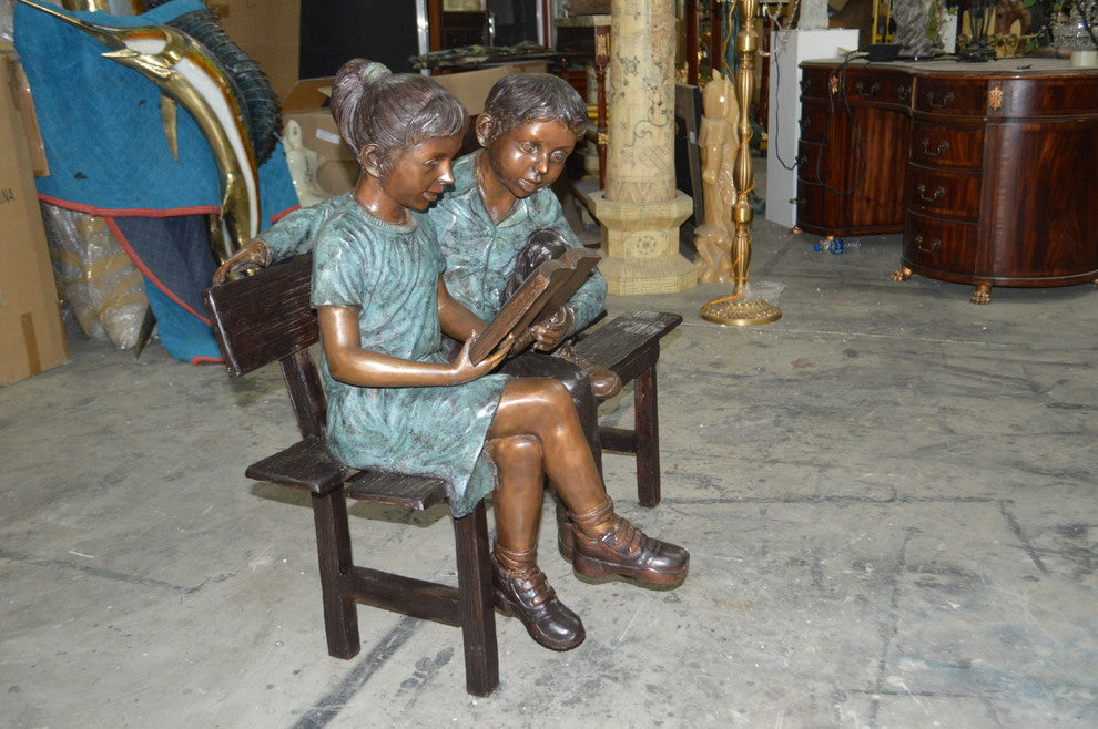 Boy and a Girl on Bench reading book bronze Statue -  Size: 43"L x 20"W x 36"H