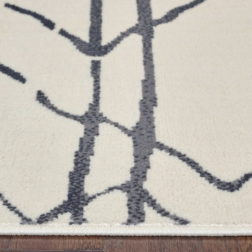 5" x 7" Cream and Black Distored Berber Area Rug