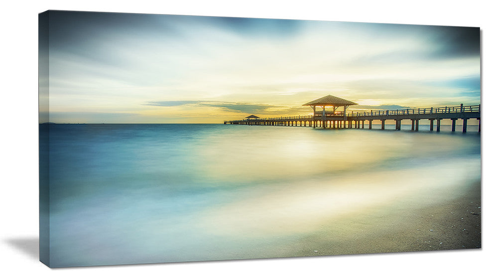 "Blue Tinged Seashore With Distant Pier" Sea Pier Wall Art Canvas Print, 40"x20"