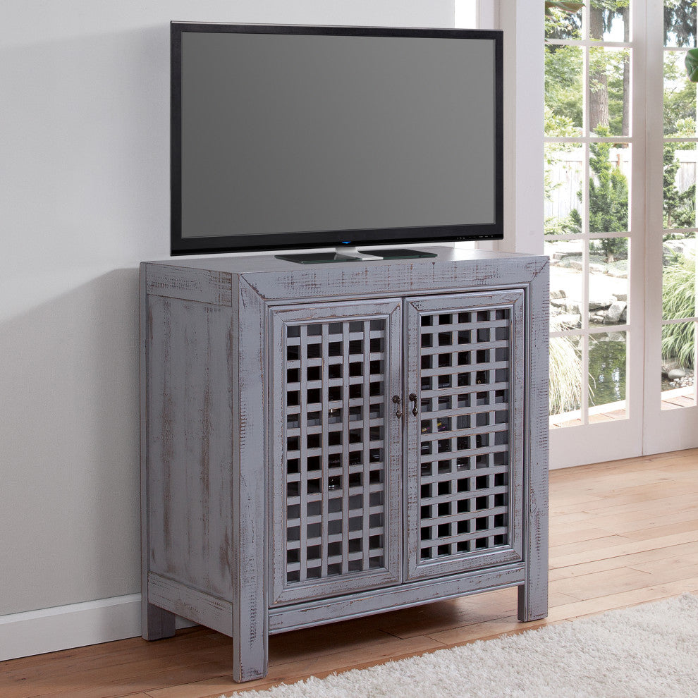 Cabinet in a living room with TV on top (lifestyle/contextual)