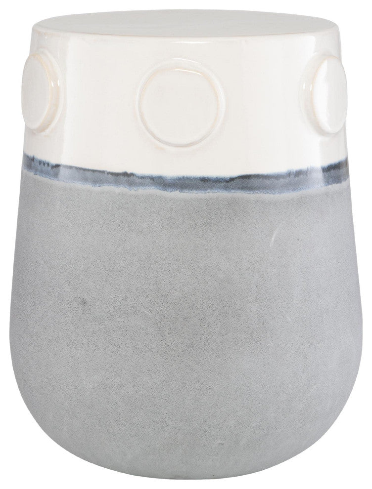 Close-up crop showing top portion with circular raised accents on a white ceramic surface against a white background.