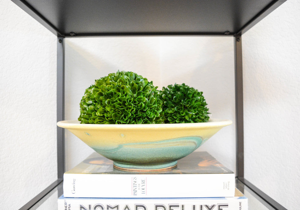 Lifestyle shot featuring the product on display/within shelving.
