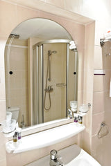Sag Harbor Frameless Arched Top Beveled Edge Tilt Mirror, Unlacquered Brass