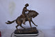 Remington Cowboy Replica Bronze Statue on Triple Marble Size: 8"x 26"x 23"H.