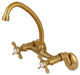 Kingston Brass 6" Adjustable Center Wall Mount Kitchen Faucet, Brushed Brass