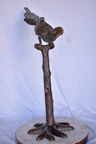 Parrot on a Tree looking Down Bronze Statue - Size: 37"L x 15"W x 47"H.