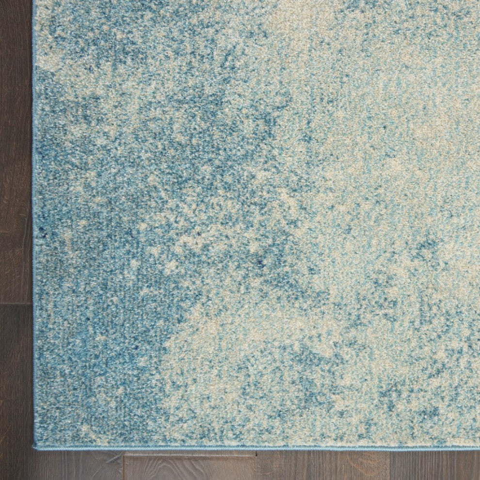 7' X 10' Ivory And Blue Abstract Power Loom Area Rug
