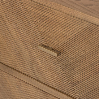 Close-up on white background of veneer seam and texture at corner.