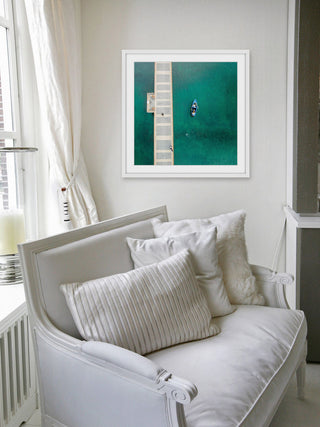 "Blue Boat Floats" Framed Print by Karolis Janulis