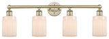 Hadley 4-Light 32" Bath Vanity Light, Antique Brass Finish, Matte White Shade