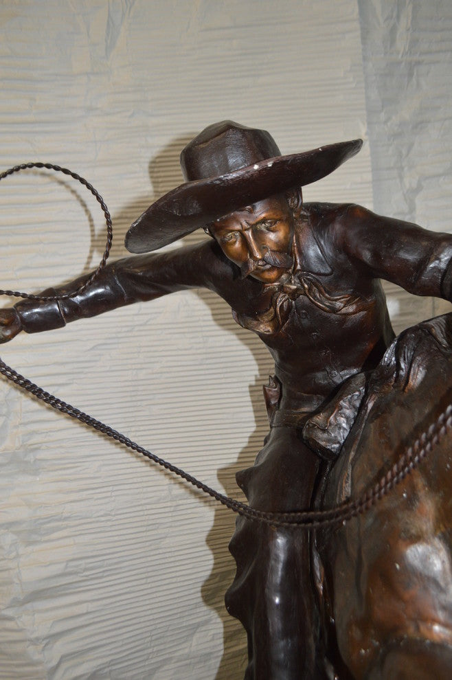 Bronco Buster Giant Bronze Statue -  Size: 65"L x 52"W x 64"H.