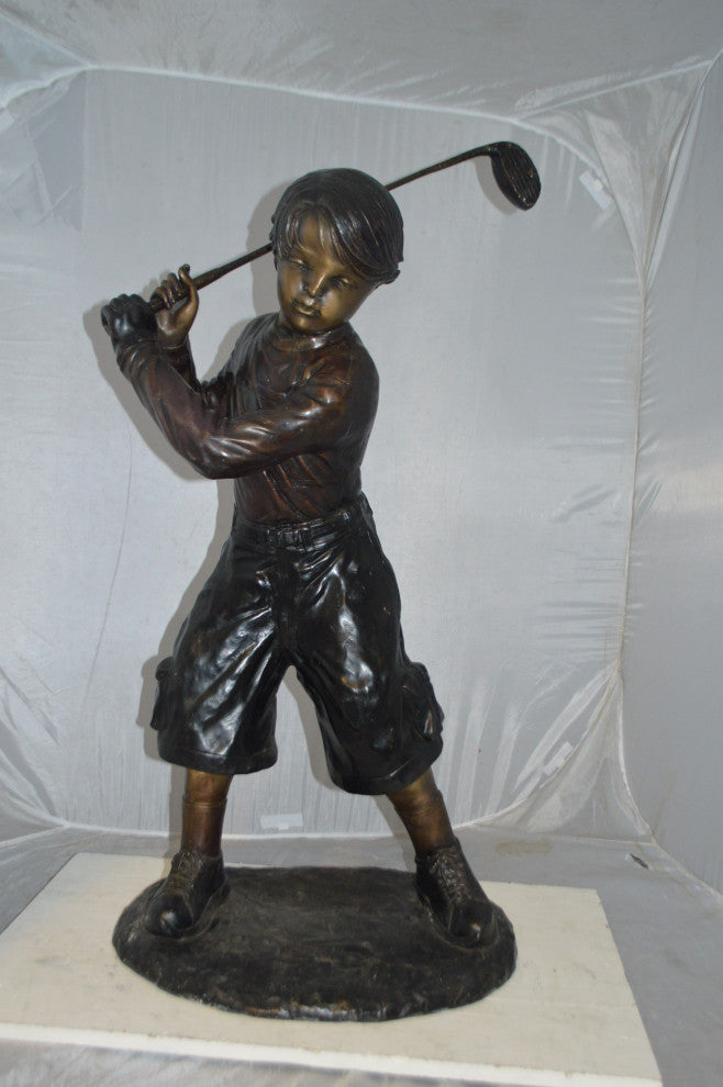 Young Boy Plays Golf Bronze Statue -  Size: 19"L x 21"W x 45"H.