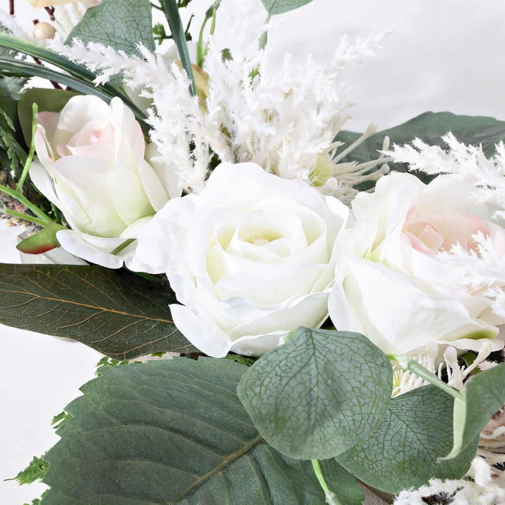 Close-up of roses and greenery on white background.