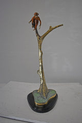 Colored Monkey Resting on a Tree Bronze Statue - Size: 12"L x 13"W x 27"H.