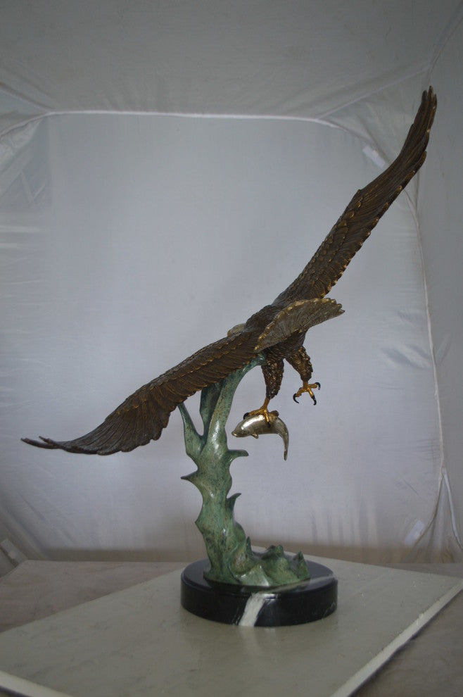 Eagle Flying With His Pray Bronze Statue -  Size: 32"L x 15"W x 33"H.