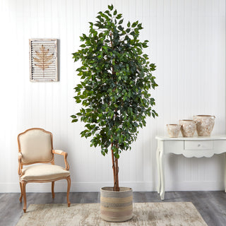 Lifestyle image showing the tree in a room with furniture and decor.