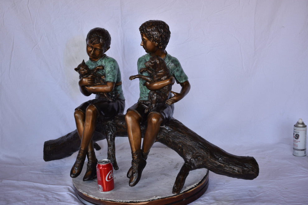 Boy and Girl With Pets Sitting on Log Bronze Statue Size: 44"L x 22"W x 26"H
