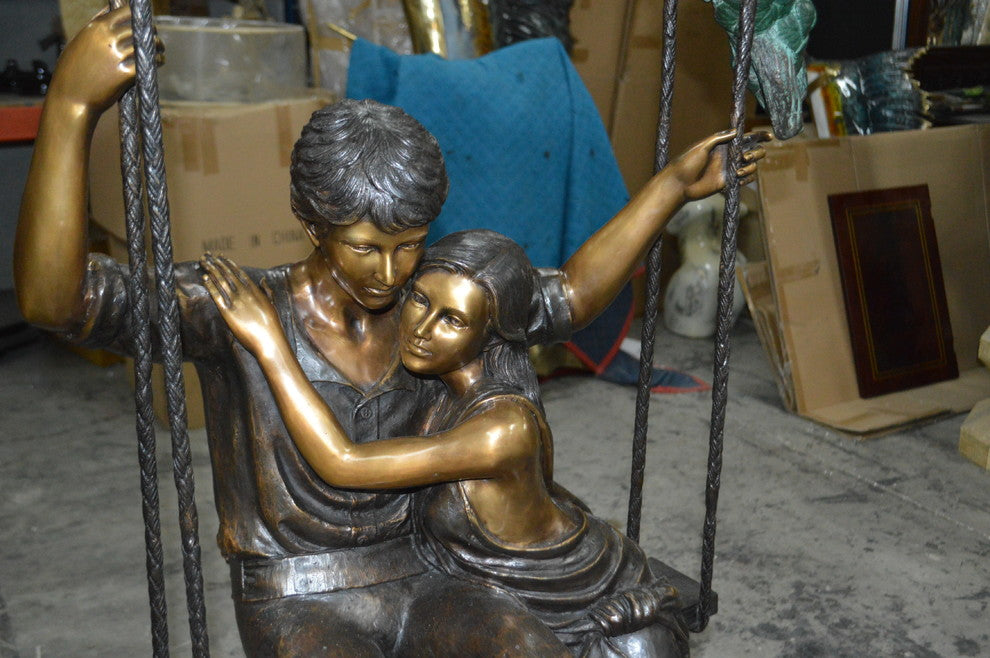 Lovers on a Swing Bronze Statue -  Size: 48"L x 32"W x 64"H.