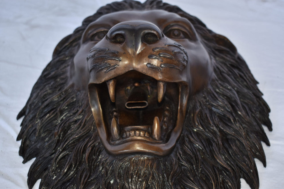 Wall Mounted Lion Face Fountain Made of Bronze Size: 12"L x 8"W x 18"H.