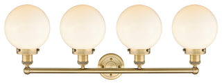 Large Beacon 4-Light 34" Vanity Light, Brushed Brass Finish, Matte White Shade