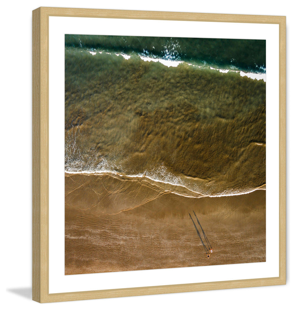 "Walking The Shore" Framed Print by Karolis Janulis